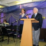 Ron Harris preaching at Holy Trinity Church in Moscow with a lady translator