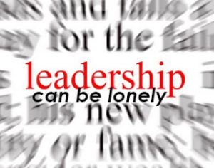 Blurred text with a focus on leadership sign